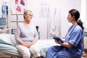 nurse talking with patient