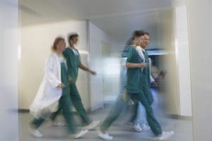 nurses walking through hospital