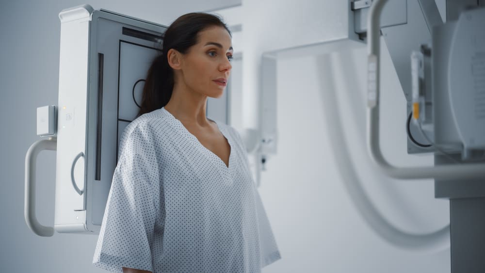 Woman getting an x-ray to check for lung cancer