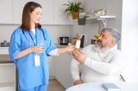 Nurse giving medication to patient with obesity