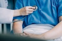 Nurse using stethoscope